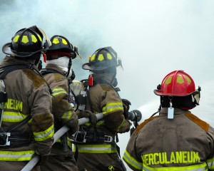 bigstockphoto_firemen_fighting_1360970